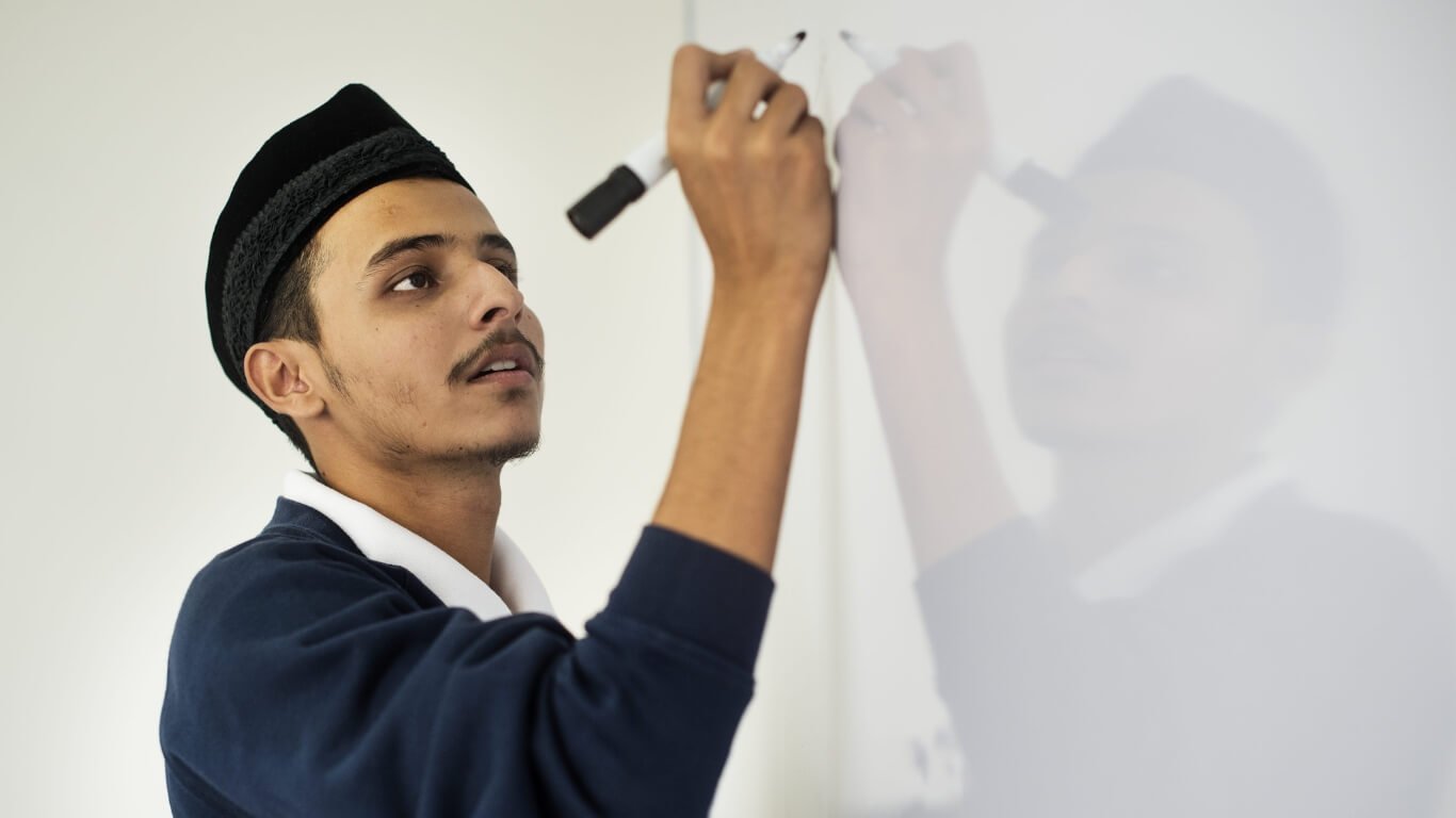 Writing on whiteboard in UAE school